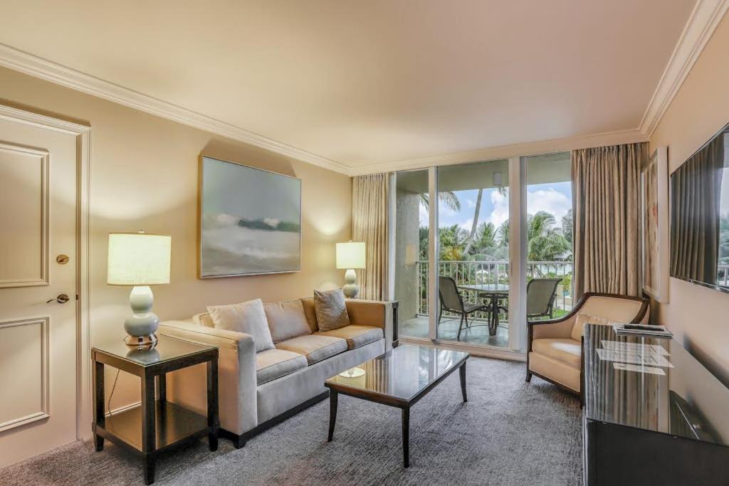a living room with a couch and a table at Marco Beach Ocean Resort Condominiums #605 in Marco Island