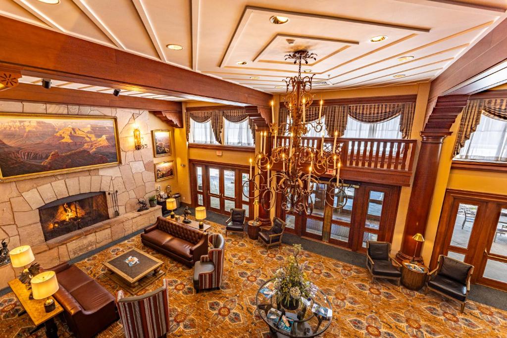 a living room with a couch and a fireplace at Grand Canyon Railway Hotel in Williams