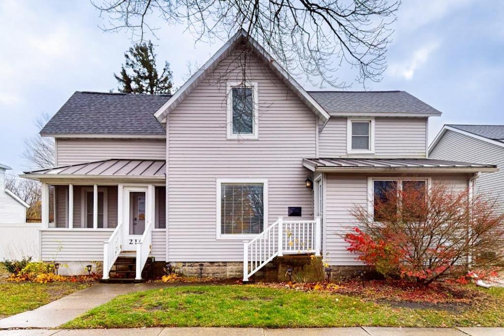 a large white house with a porch at South Haven Retreat in South Haven