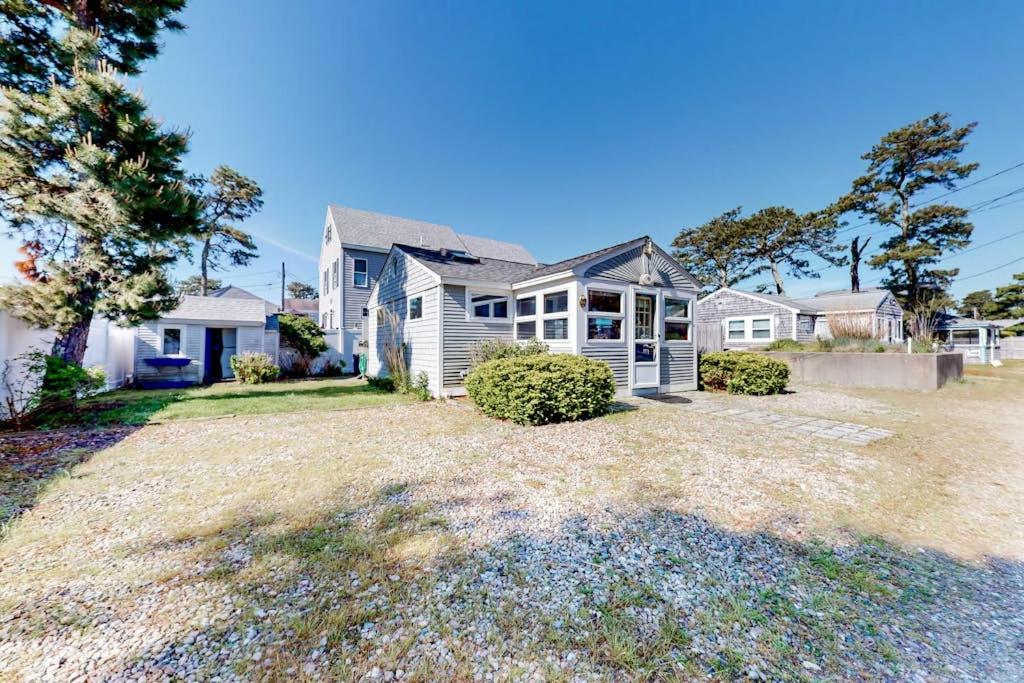 a large house with a yard in front of it at Glendon Beach Getaway in Dennis