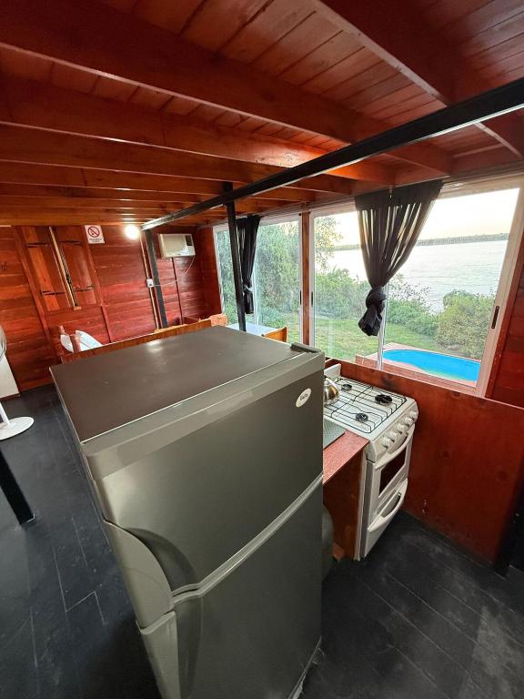 a kitchen with a stove and a stove top oven at El Amado in General Alvear