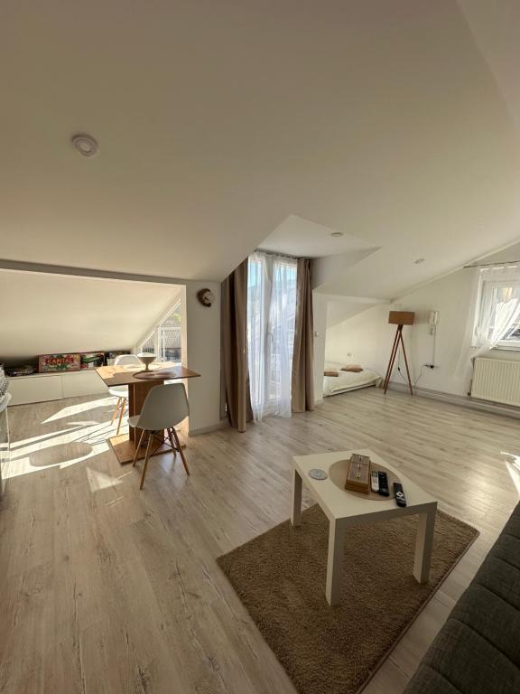 a living room with a couch and a table at Prestige in Arandelovac