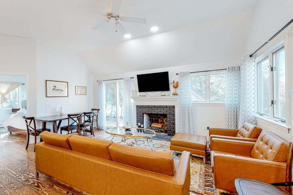 a living room with a couch and a fireplace at Tranquil Getaway in Wellfleet