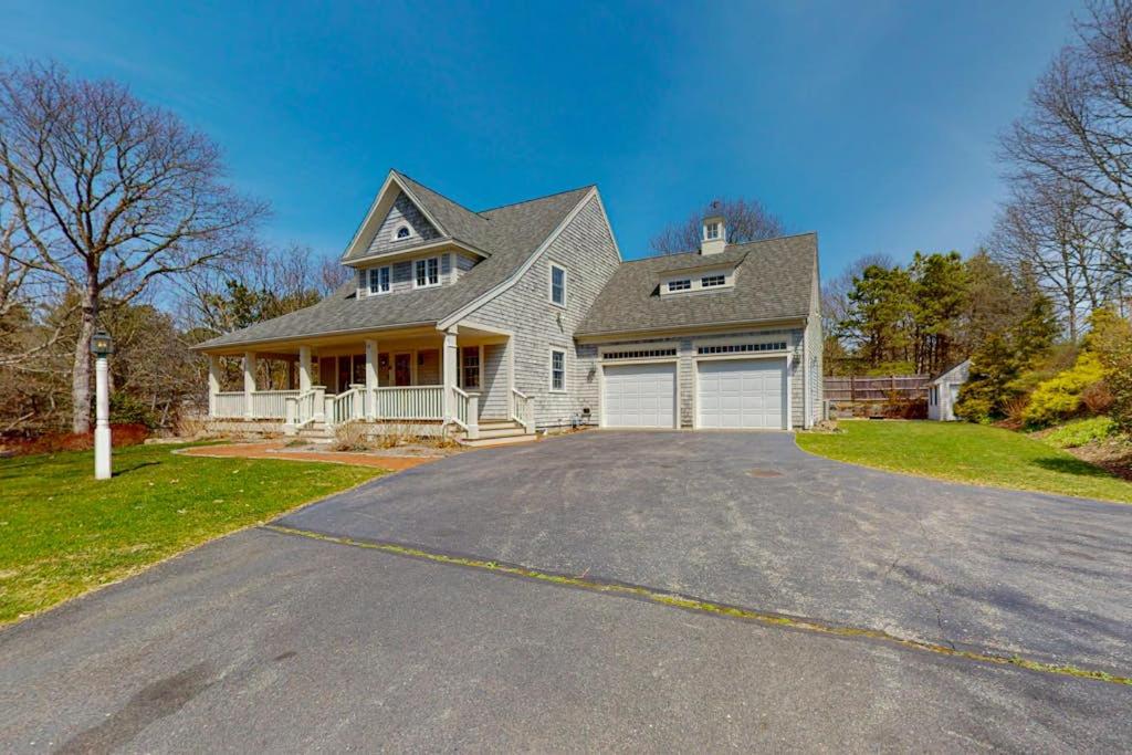a large house with a driveway in front of it at Cotuit Mannor in Cotuit