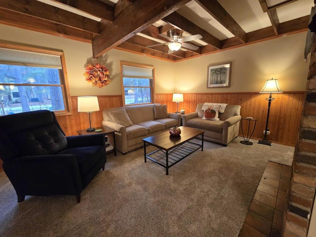 a living room with a couch and a table at Saltbox in Thompsonville