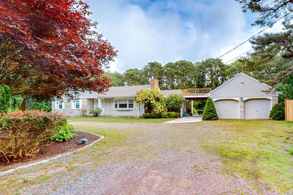 a large white house with a driveway at Beach Happy in Harwich Port