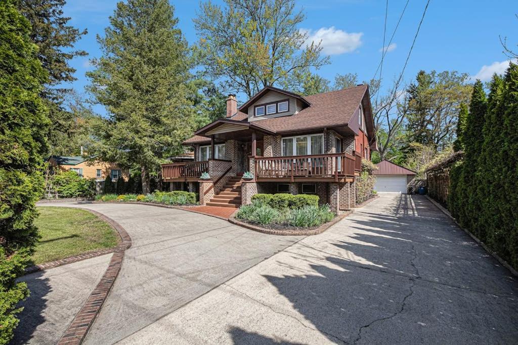 a home with a driveway leading to a house at The Townline House in Union Pier