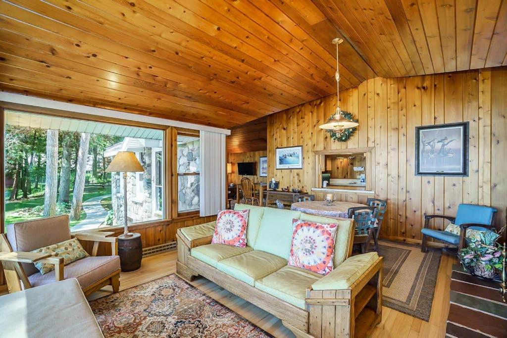 a living room with a couch and a table at Serenity in Honor