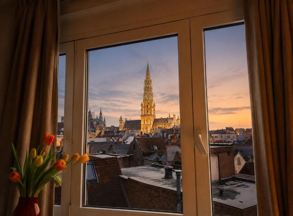 a view of a clock tower from a window at Centerstay Brussels in Brussels
