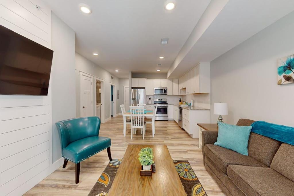 a living room with a couch and a table at Cozy TC Bay Condo in Traverse City