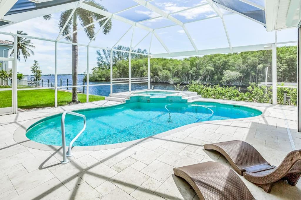 an image of a swimming pool in a house at Cape Coral Haven in Cape Coral