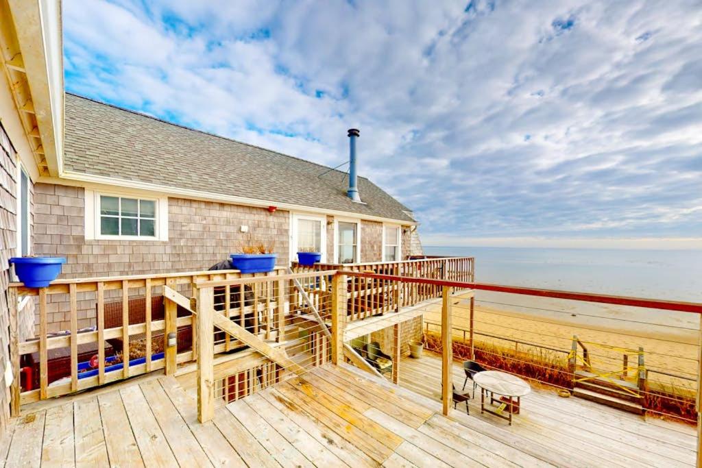 a house with a deck with a view of the beach at The Lighthouse in Provincetown
