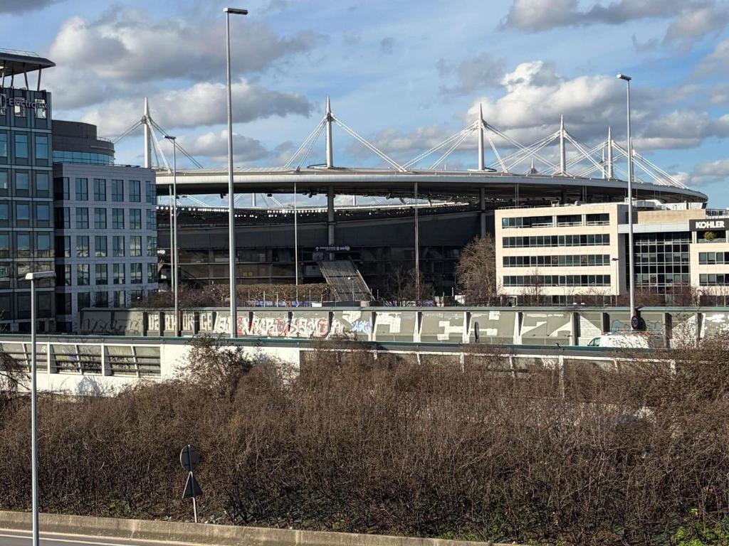a view of a baseball stadium with a bridge at ibis Paris Saint-Denis Stade Sud in Saint-Denis