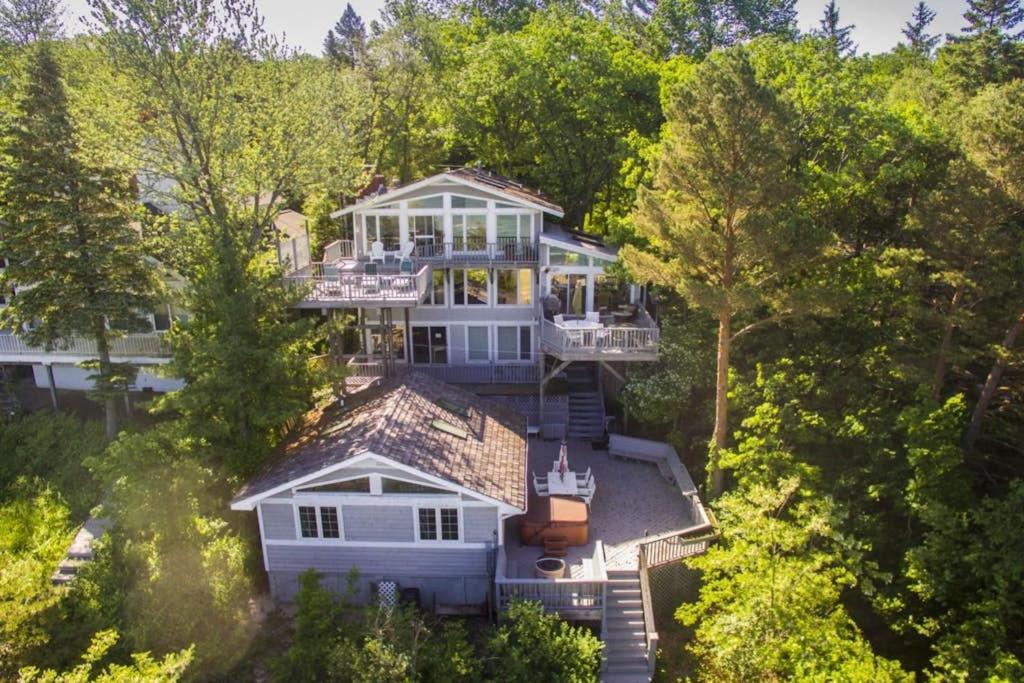 an aerial view of a large house in the trees at 2nd Base in Sawyer