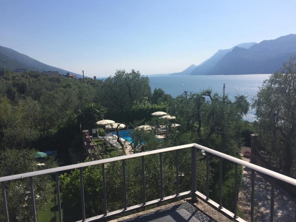 a balcony with a view of the water at Villa Gaia Apartments pool wifi parking in Malcesine