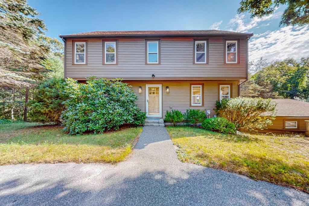 a large house with a driveway in front of it at Private Pocasset Getaway in Pocasset