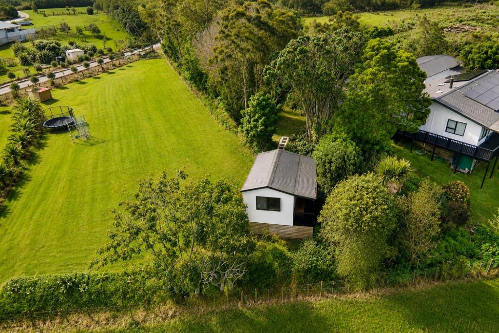 an aerial view of a house with a yard at Country Nirvana in Pataua