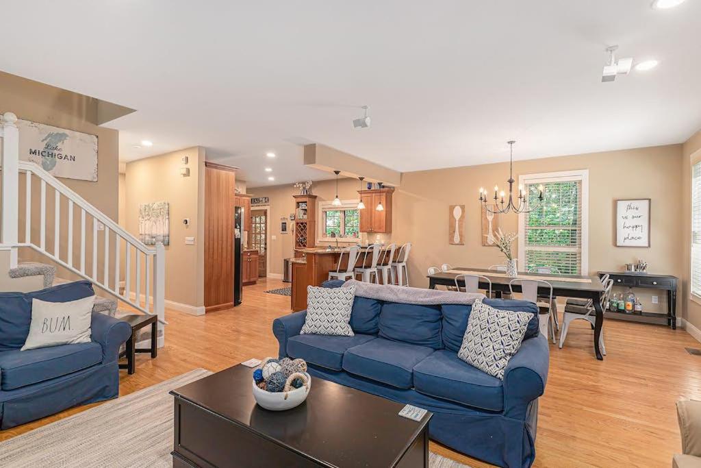 a living room with a blue couch and a table at The Oasis at Forest Beach in New Buffalo