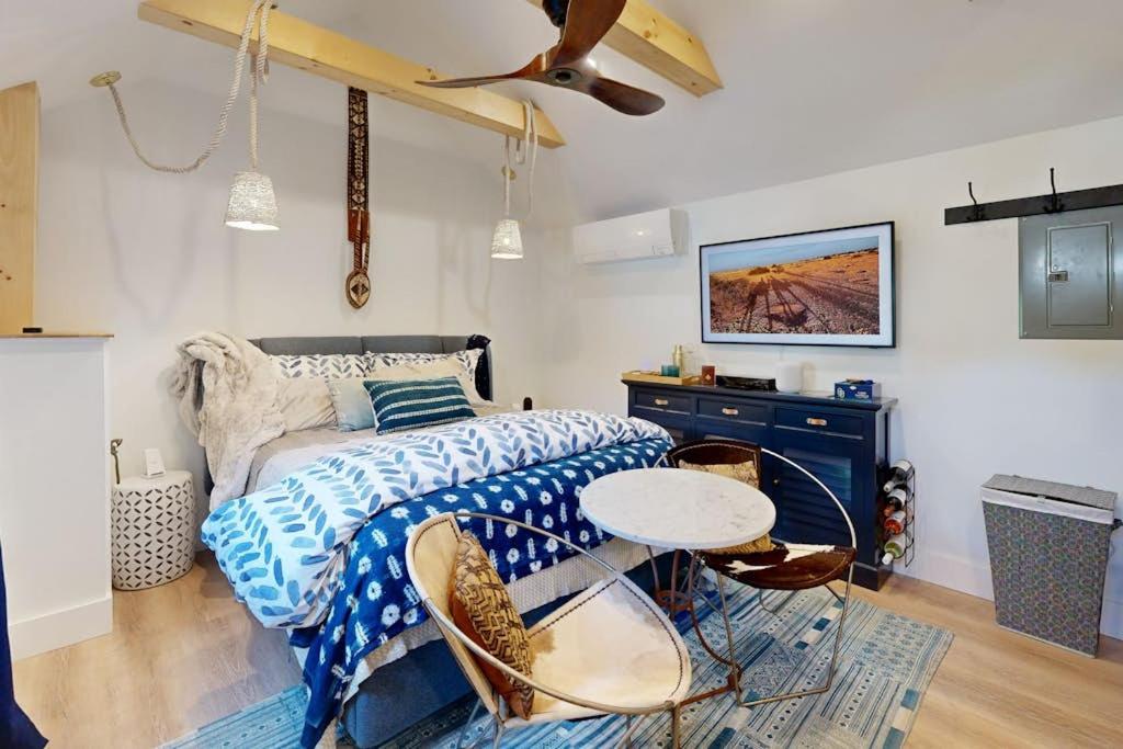 a bedroom with a bed and a table at Sankofa Studio in Oak Bluffs