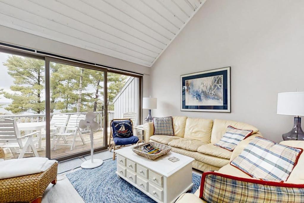 a living room with a couch and a table at Wilderness 9 in Glen Arbor