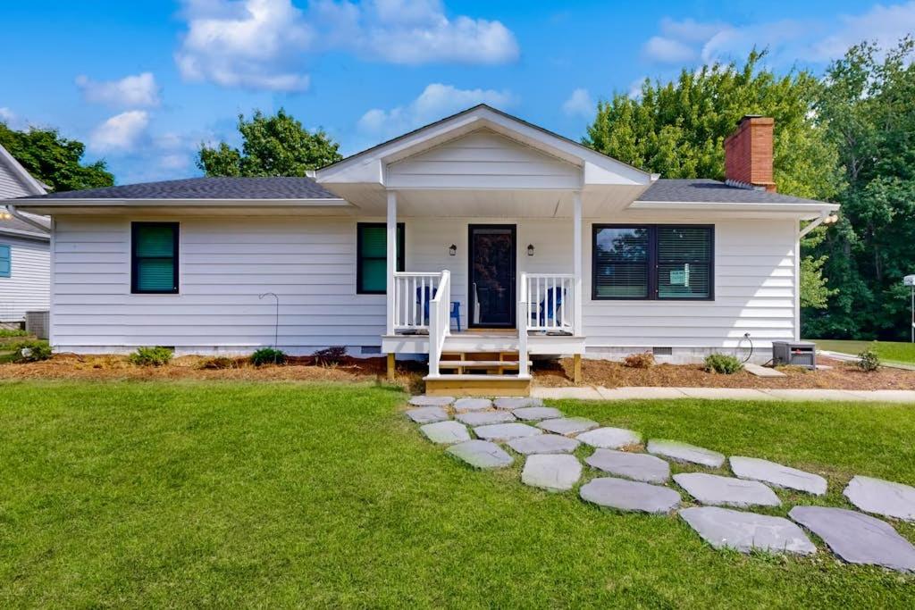 a white house with a stone pathway in front of it at Mill Run Estates --- 31863 Mill Run Dr in Ocean View