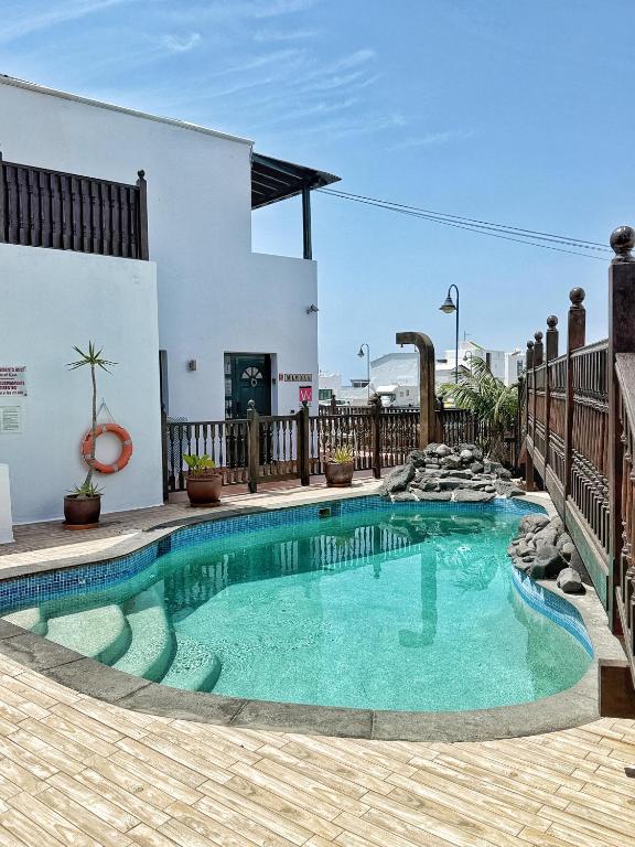 a swimming pool in the middle of a patio at Casa Lava in Punta Mujeres