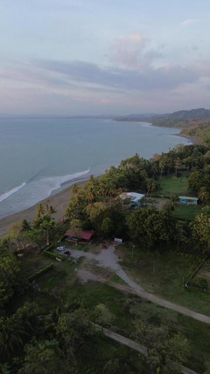 an aerial view of a beach and the ocean at One Piece in Golfito