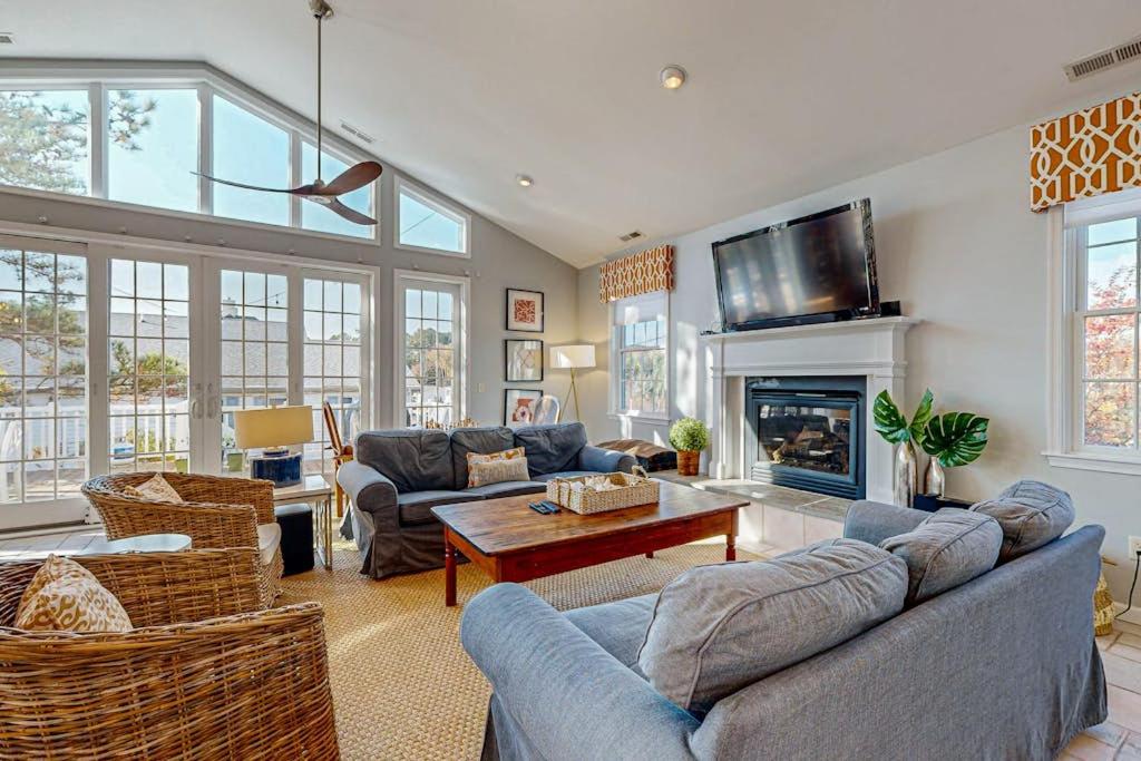 a living room with couches and a tv at Rehoboth Beach --- 21163 Bayview Rd. in Dewey Beach