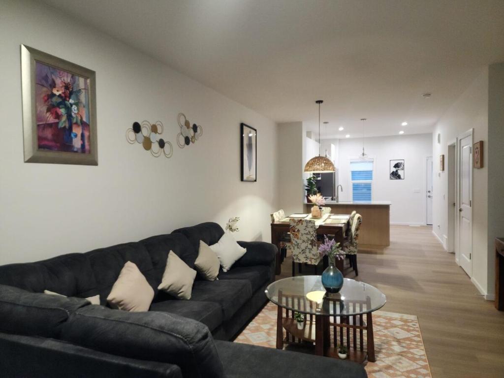 a living room with a couch and a table at Edmonton 3BR House in Edmonton