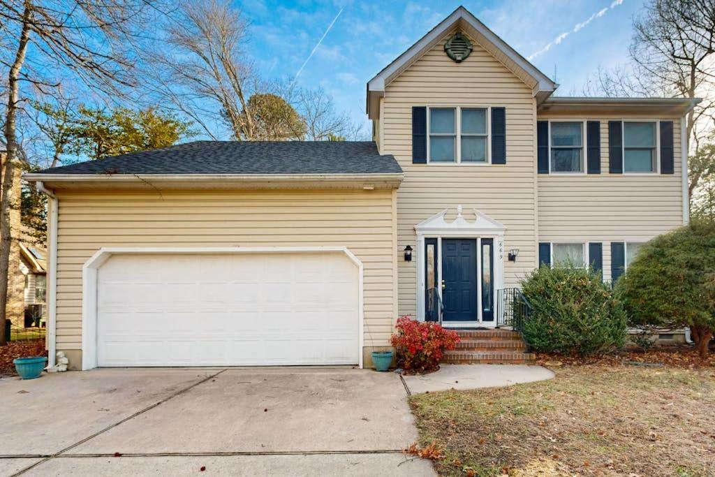 a house with a white garage at Salt Pond --- 669 Bethany Loop in Bethany Beach
