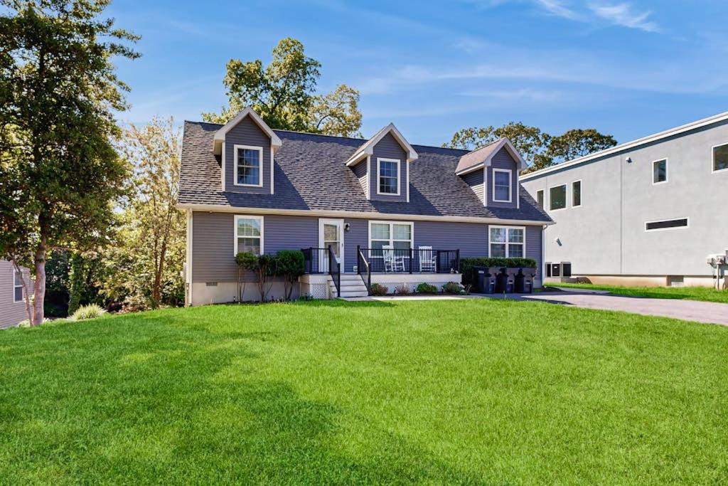 a house with a green lawn in front of it at Rehoboth Beach --- 18 Sabrina Dr in Lewes