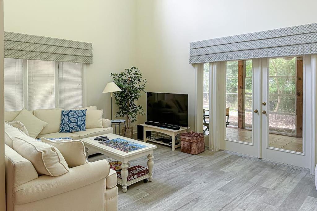 a living room with a couch and a tv at Sea Colony --- 55084 Pinewood Circle in Bethany Beach