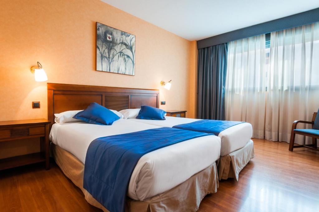 Postel nebo postele na pokoji v ubytování Hotel Las Provincias