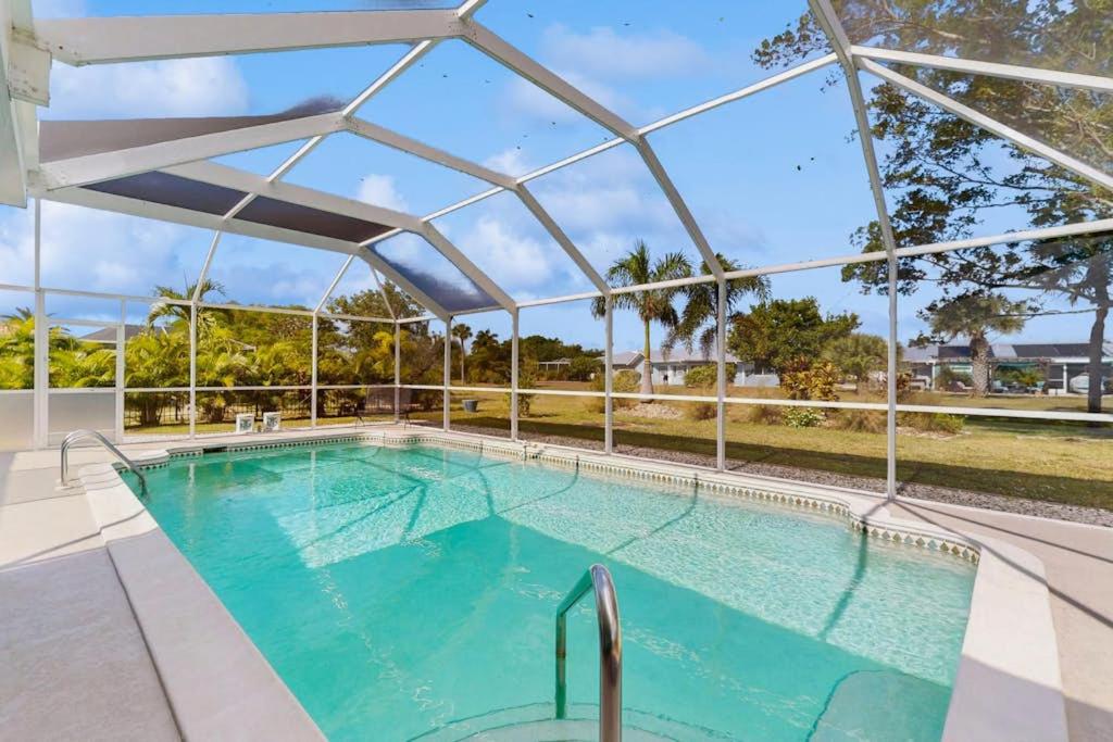 an indoor swimming pool with a clear cover over it at Lil Blue in Punta Gorda