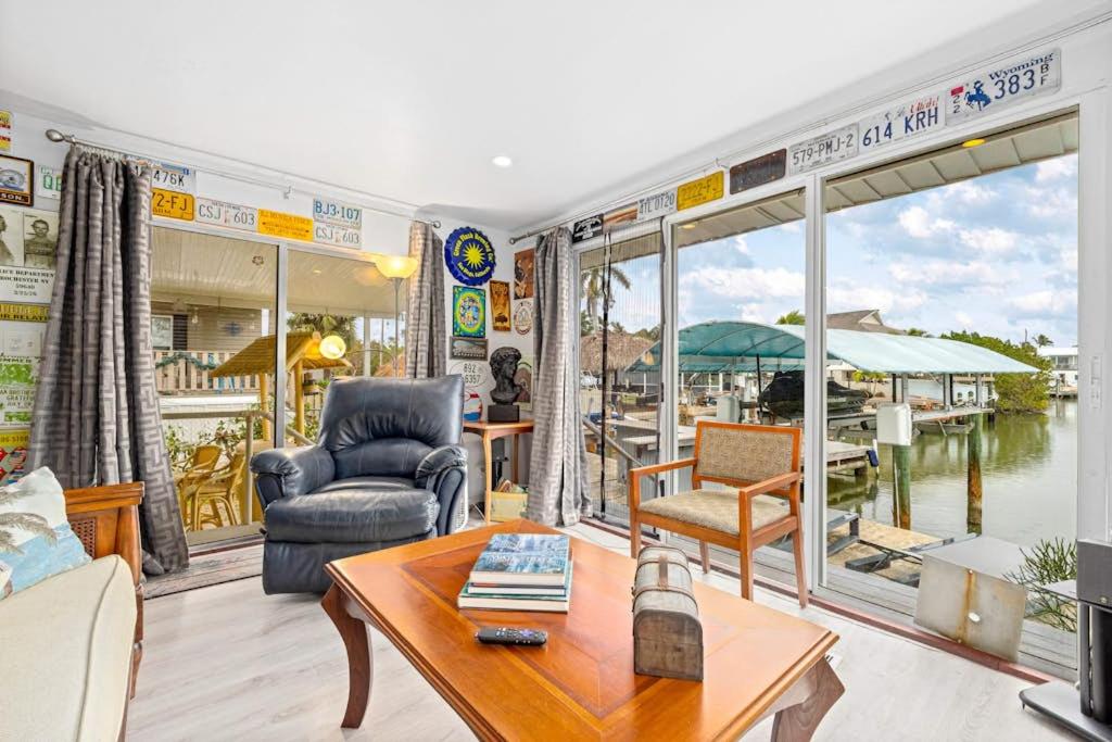 a living room with a view of a marina at Sunset Escape in Marco Island