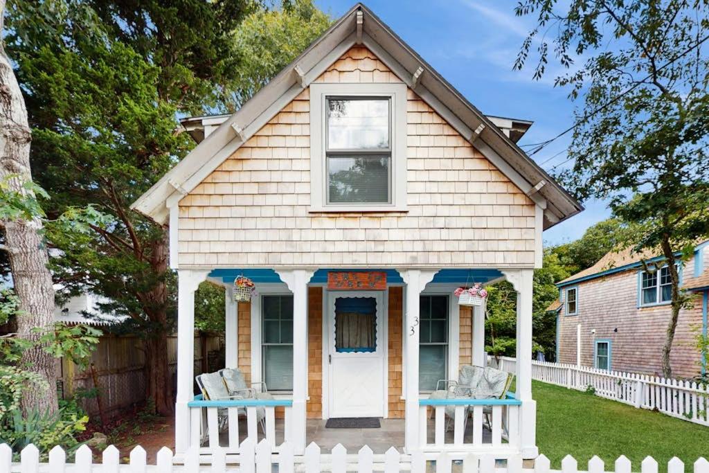 a small house with a white fence at TumbleINN in Oak Bluffs