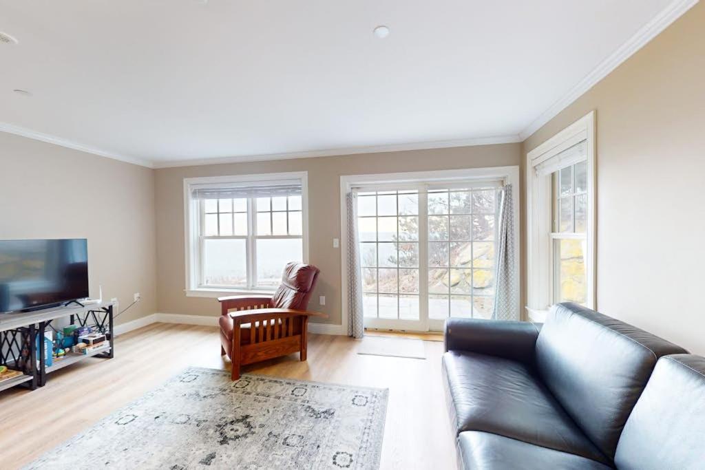 a living room with a couch and a tv at Summer Cape Escape in Dennis Port
