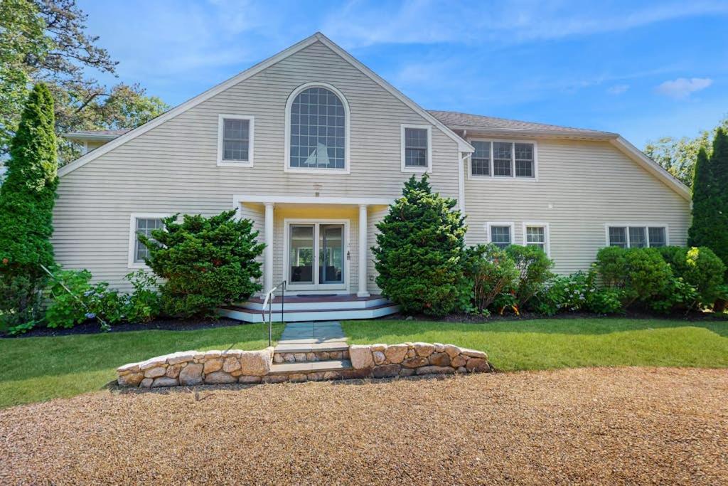 a large white house with a large window at Family Getaway in Oak Bluffs