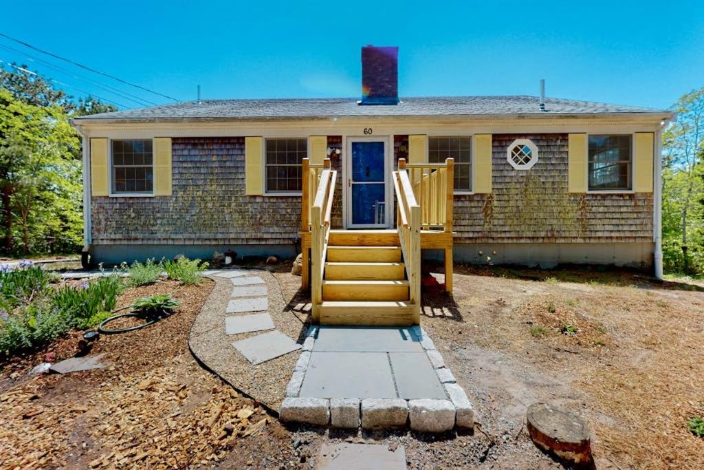 a house with a set of stairs in front of it at Tall Pines in Wellfleet