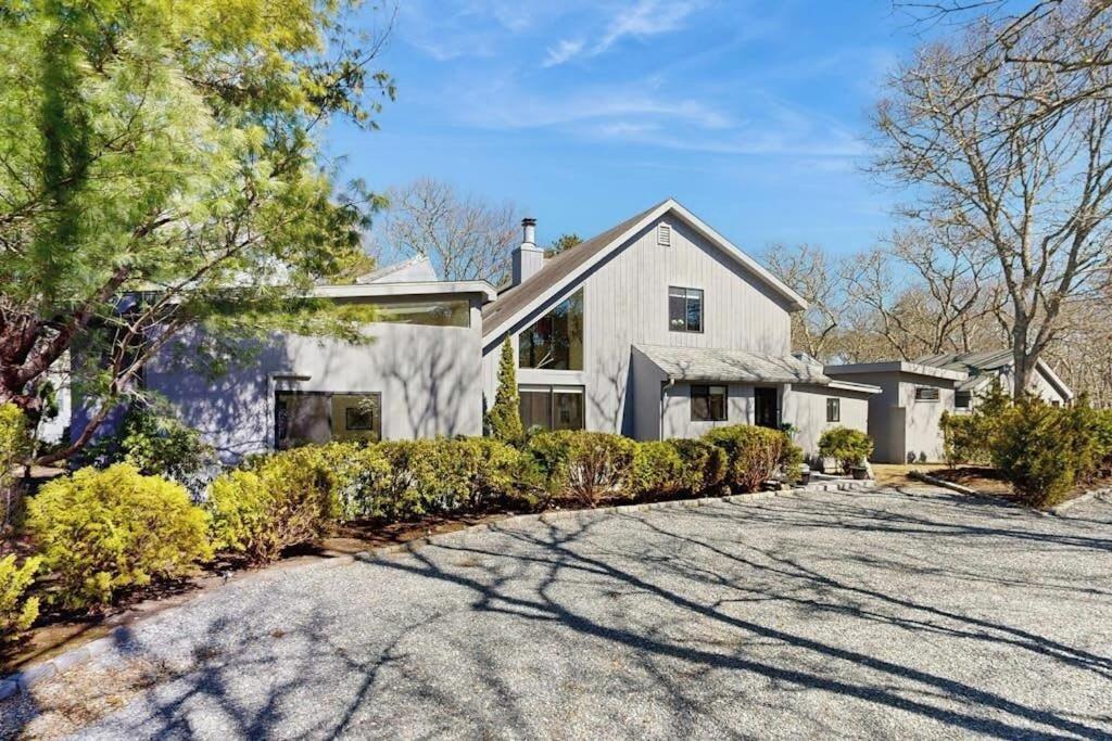 a large white house with a driveway at Twin Ponds in Oak Bluffs