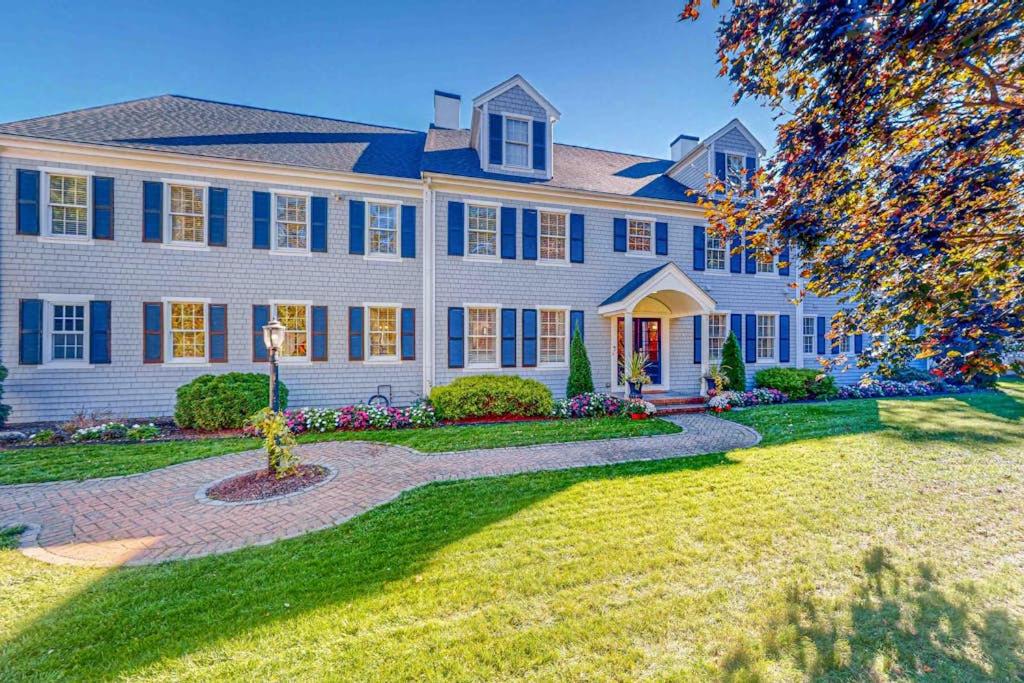 a large house with blue shutters at Plum Paradise in Barnstable