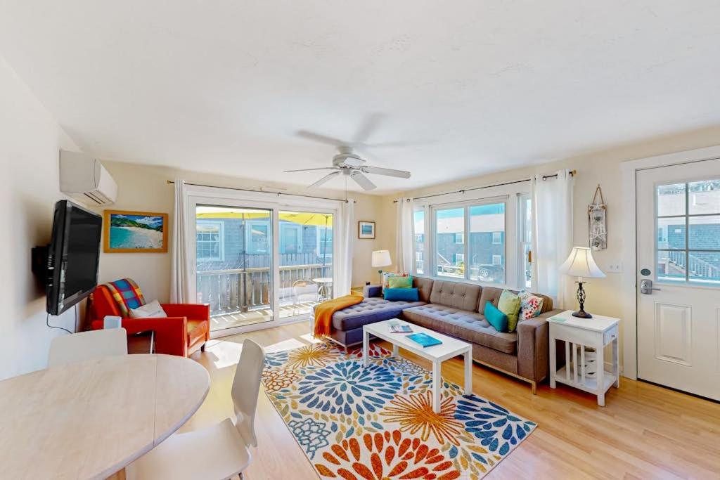 a living room with a couch and a table at Beach Blessing in Provincetown