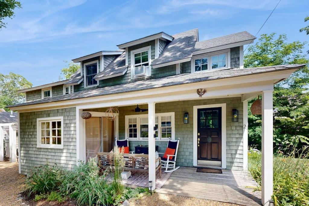 a house with a front porch with a deck at Sankofa House in Oak Bluffs