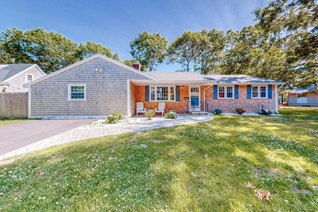 a home with a brick house at Falmouth Beach House in Falmouth