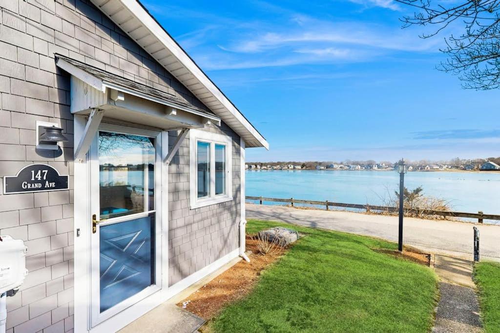 a building with a door with a view of the water at SEA-esta in Falmouth
