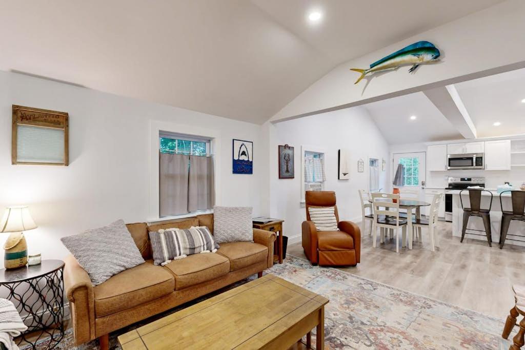 a living room with a couch and a table at Gateway to Cape Cod in West Yarmouth