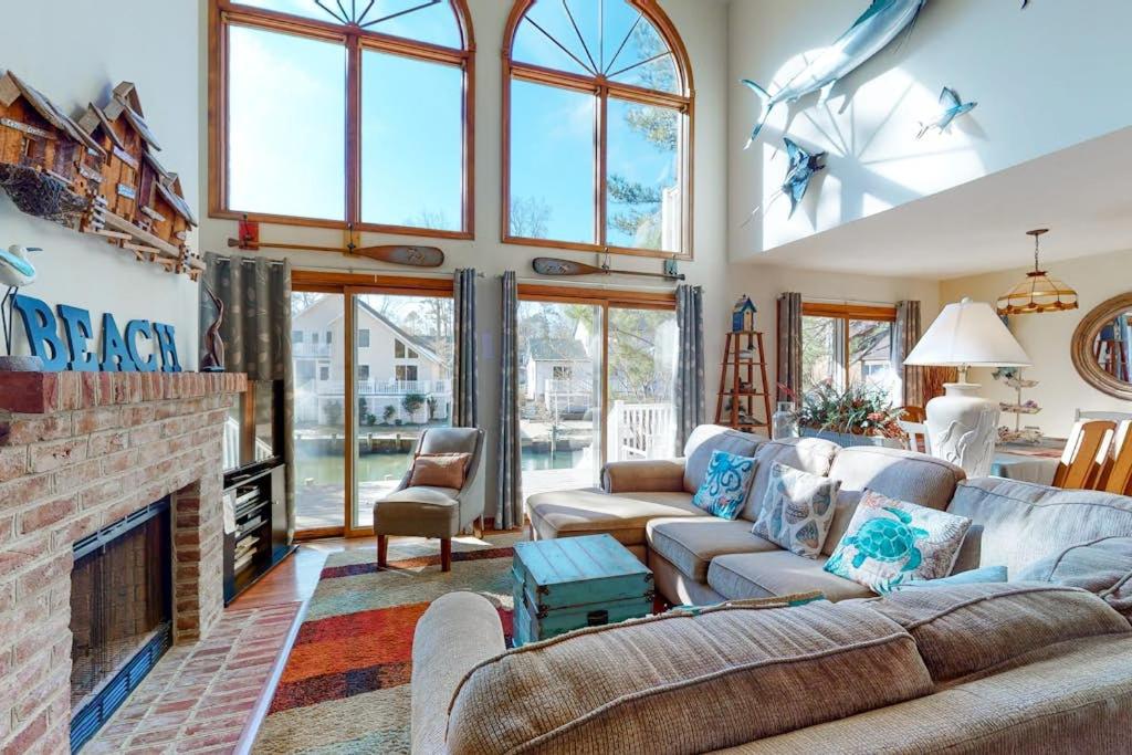 a living room with a couch and a fireplace at Dove Lane 8 in Ocean Pines