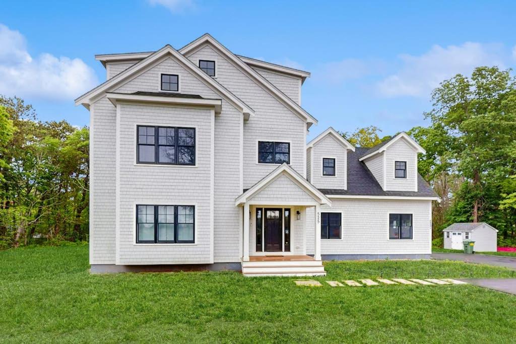 a large white house with a large yard at Heritage Escape in Mashpee