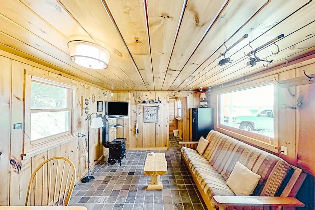 a living room with a couch and a table at Dune Grass Shores in Beulah