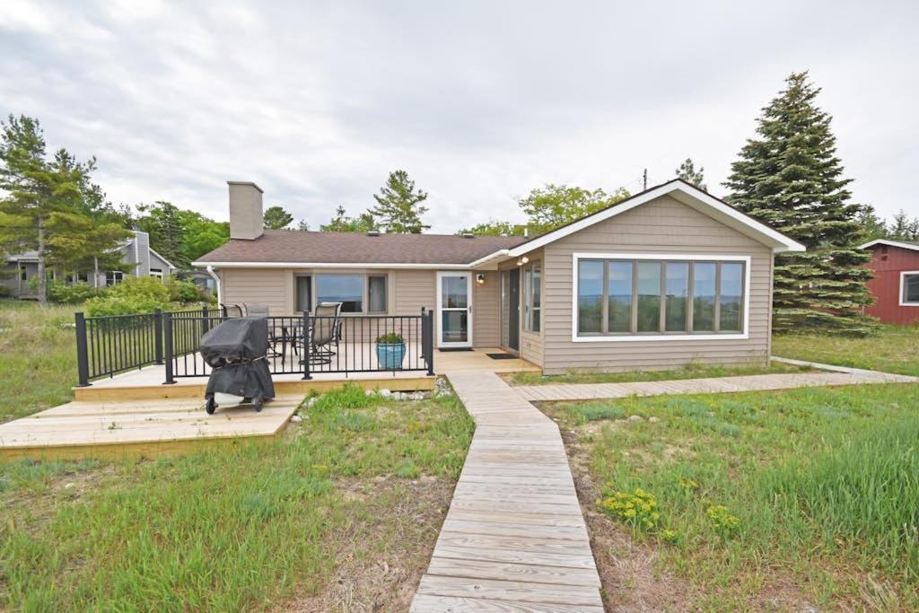 a house with a walkway in front of a house at Ships Haven in Glen Arbor